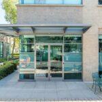 Professional glass entrance and main lobby doors for 9930 Irvine Center Drive office building.