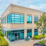 Modern creative office exterior at 9930 Irvine Center Drive in the Irvine Spectrum district.