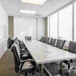 Executive second-floor conference room with glass partitions and creative design elements.